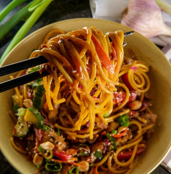 Spicy Thai chicken peanut butter lo mein noodles with tuxedo sesame seeds